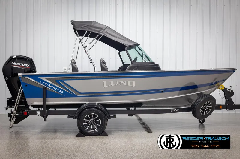 Slide: The Image of 2025 Lund 1775 Impact XS boat with Mercury engine on trailer. - 5
