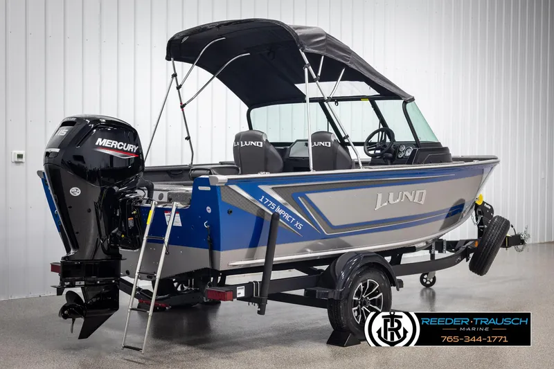 Slide: The Image of 2025 Lund 1775 Impact XS boat with Mercury engine in showroom. - 6