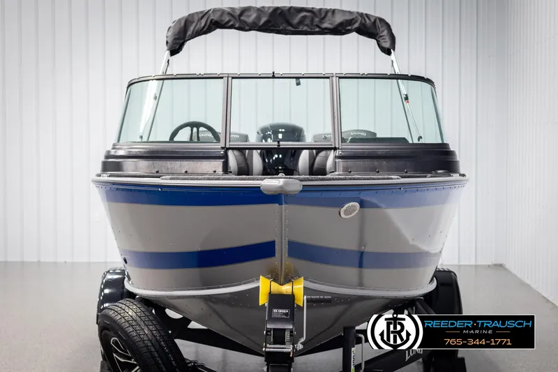 Slide: The Image of 2025 Lund 1775 Impact XS boat, front view, in showroom setting. - 8