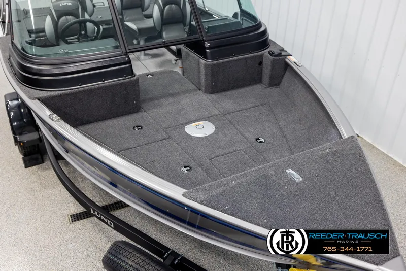 Slide: The Image of 2025 Lund 1775 Impact XS boat with spacious deck and seating. - 9