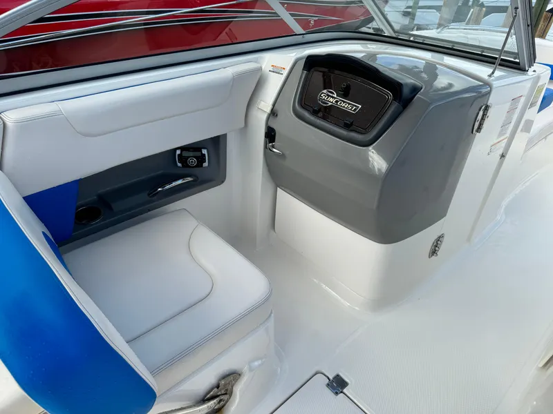 Slide: The Image of 2017 Chaparral 250 Suncoast boat interior with seating and storage compartment. - 15