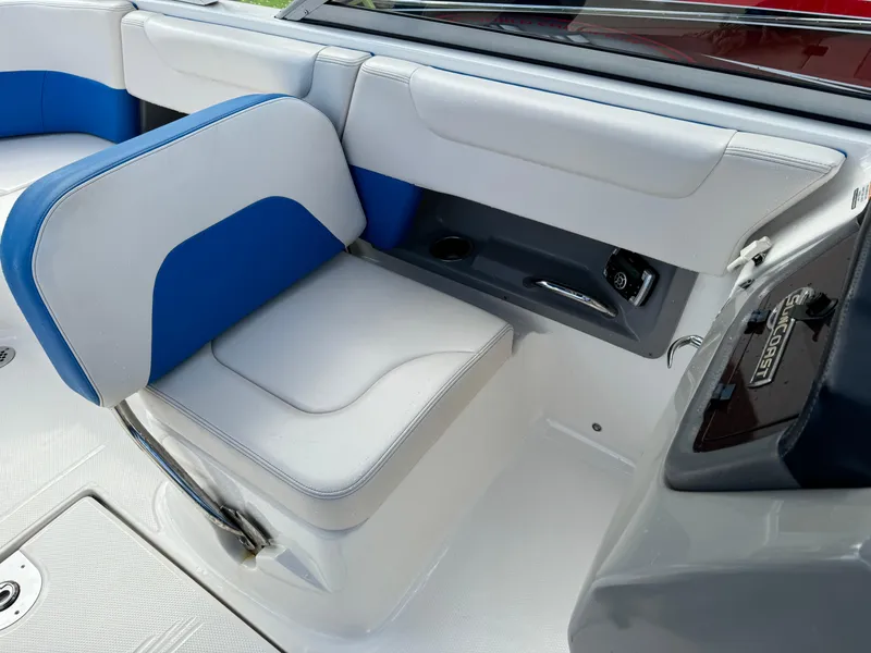 Slide: The Image of 2017 Chaparral 250 Suncoast boat interior with blue and white seating. - 17