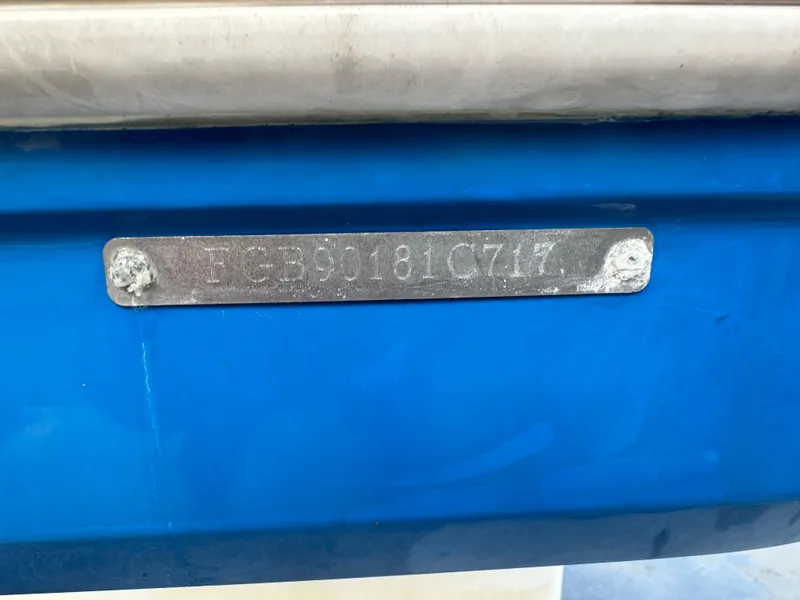 Slide: The Image of 2017 Chaparral 250 Suncoast boat hull identification number on blue surface. - 25