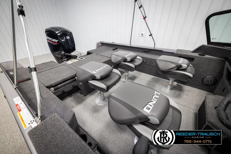 Slide: The Image of 2025 Lund 1875 Impact XS boat interior with Mercury engine and seating arrangement. - 21