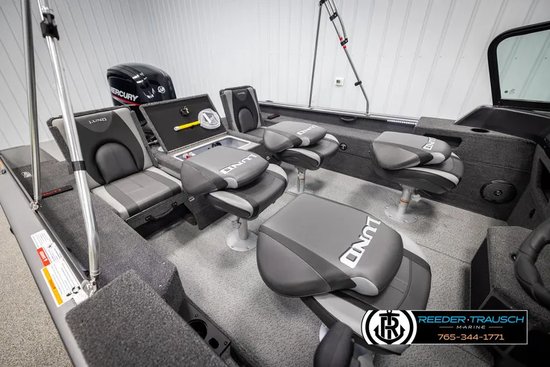 Slide: The Image of 2025 Lund 1875 Impact XS boat interior with seating and Mercury engine. - 22