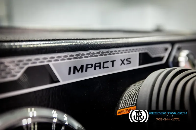 Slide: The Image of Close-up of 2025 Lund 1875 Impact XS dashboard with branding and warning label. - 27