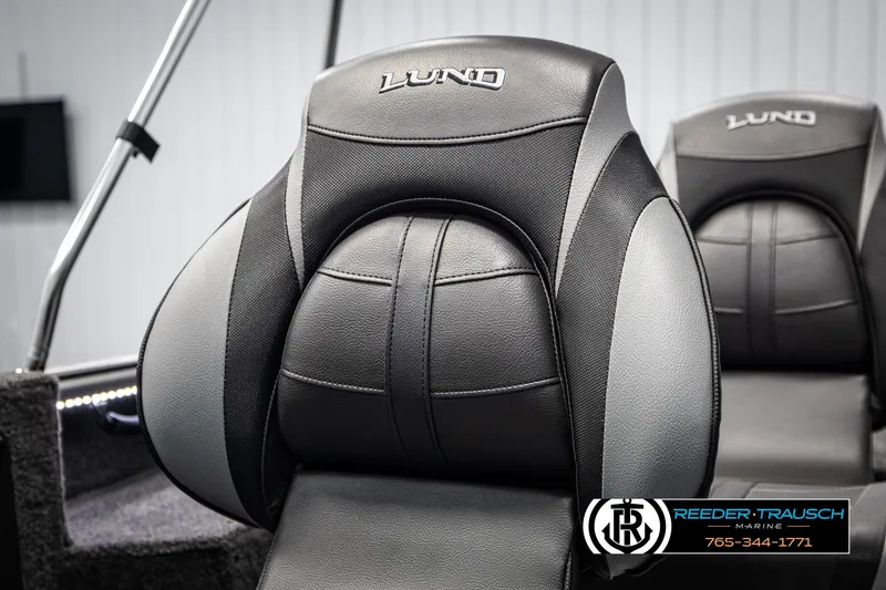 Slide: The Image of 2025 Lund 1875 Impact XS boat seat, black and gray design, Reeder-Trausch Marine logo visible. - 30