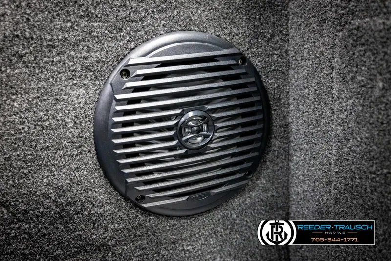 Slide: The Image of Speaker grille on 2025 Lund 1875 Impact XS boat interior, Reeder-Trausch Marine logo visible. - 34