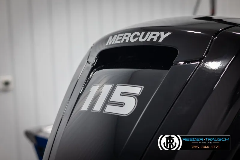 Slide: The Image of Mercury 115 outboard motor on 2025 Lund 1875 Impact XS boat, Reeder-Trausch Marine branding. - 42