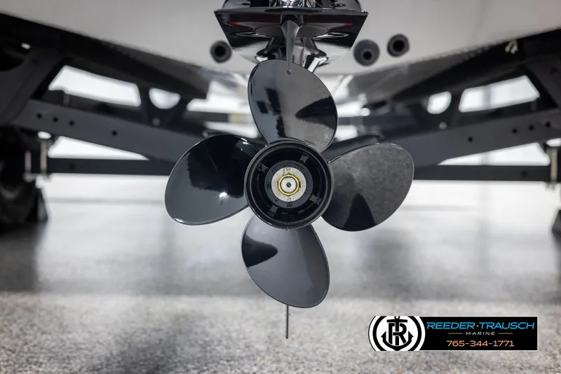 Slide: The Image of Propeller of 2025 Lund 1875 Impact XS boat on display in showroom. - 43