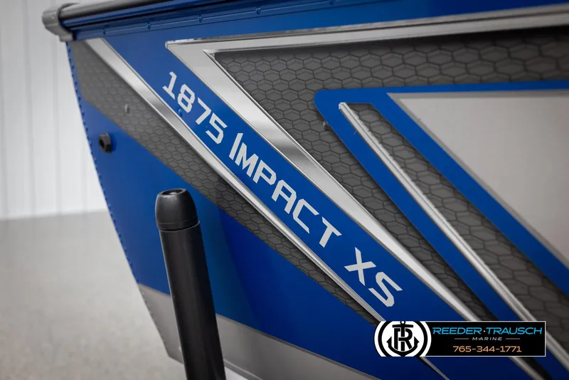 Slide: The Image of 2025 Lund 1875 Impact XS boat, blue and silver design, Reeder-Trausch Marine branding. - 44