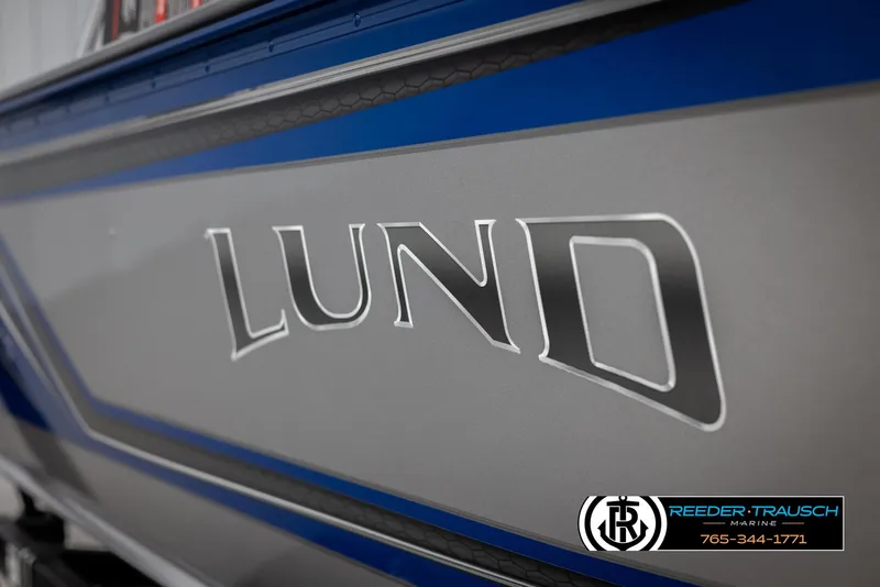 Slide: The Image of 2025 Lund 1875 Impact XS boat, close-up of logo and sleek design. - 45