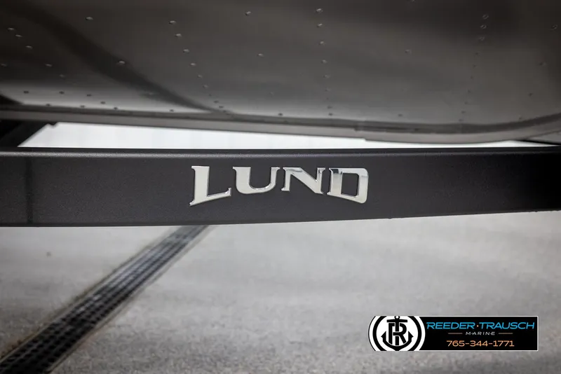 Slide: The Image of 2025 Lund 1875 Impact XS boat trailer with logo, Reeder-Trausch Marine branding. - 47