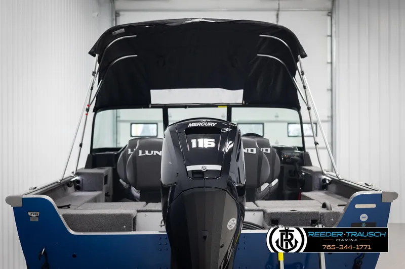 Slide: The Image of 2025 Lund 1875 Impact XS boat with Mercury 115 engine in showroom. - 6