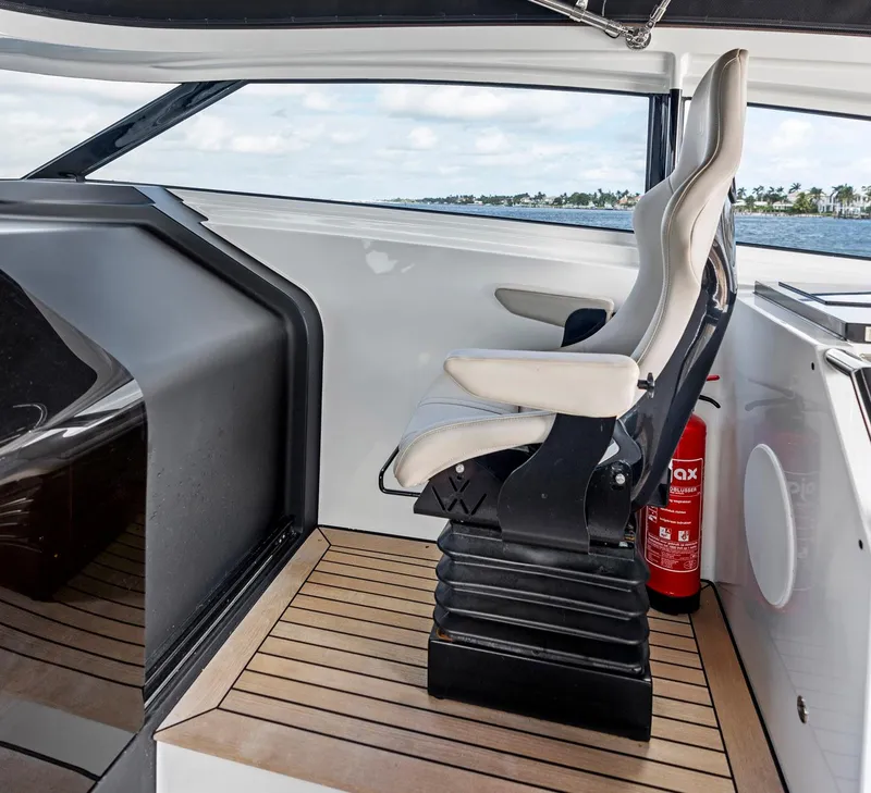 Slide: The Image of Luxury helm seat on 2021 Sichterman Libertas 54 yacht, featuring sleek design and modern interior. - 21