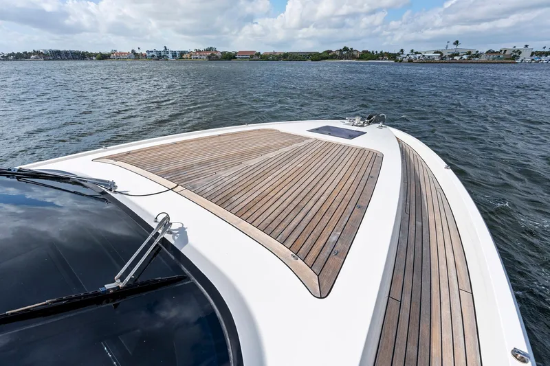 Slide: The Image of Sichterman Libertas 54 yacht, 2021 model, featuring sleek wooden deck on open water. - 34