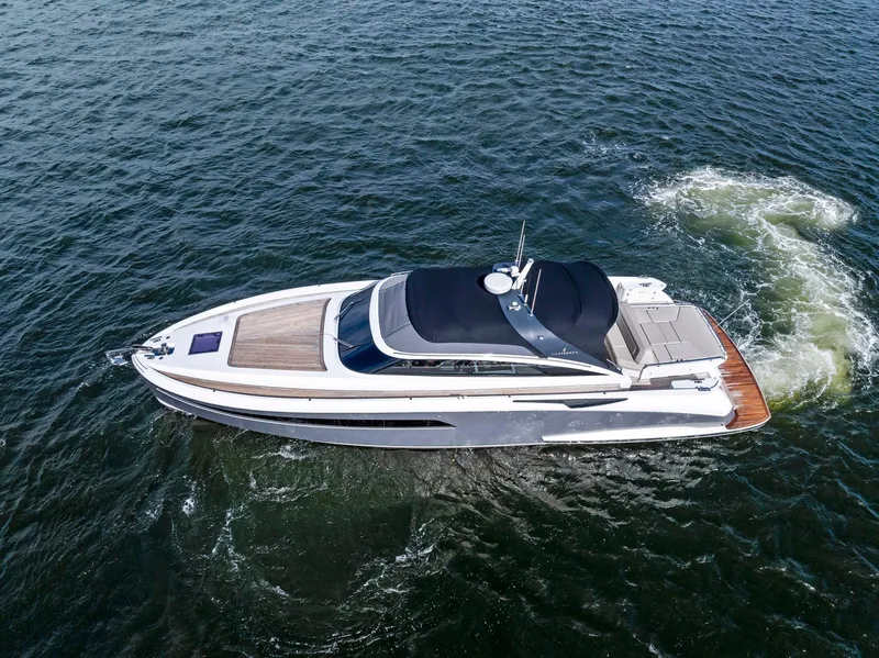 Slide: The Image of Aerial view of 2021 Sichterman Libertas 54 yacht cruising on open water. - 48