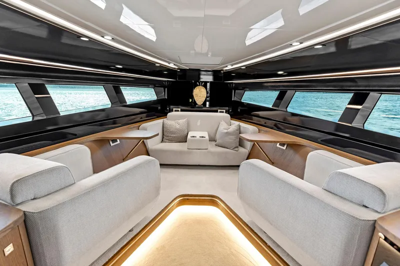 Slide: The Image of Luxurious interior of 2021 Sichterman Libertas 54 yacht with elegant seating and panoramic windows. - 6