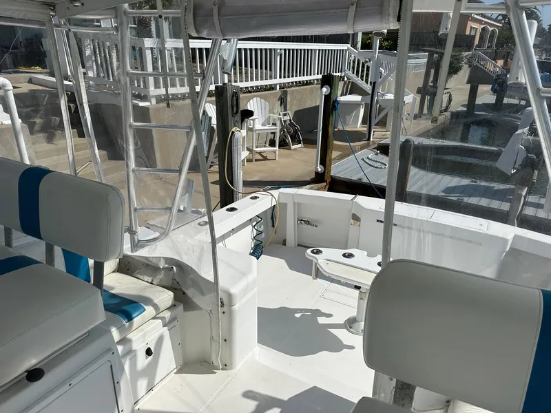 Slide: The Image of Interior view of a 2000 Cabo 31 Express boat docked at a marina. - 7