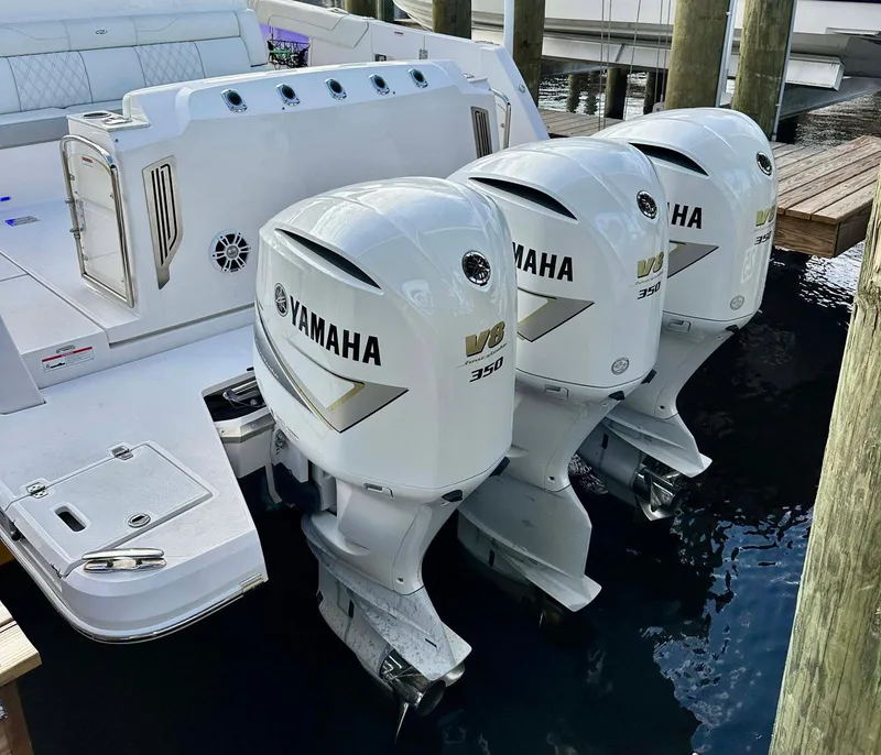 Slide: The Image of 2021 Regal 38 SAV boat with triple Yamaha V8 350 outboard engines. - 11