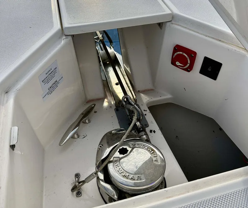 Slide: The Image of Anchor compartment of 2021 Regal 38 SAV boat with winch and chain. - 16