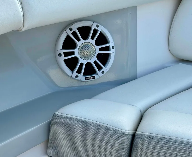 Slide: The Image of Fusion speaker on 2021 Regal 38 SAV boat with white seating. - 18