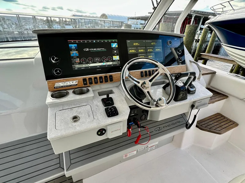 Slide: The Image of 2021 Regal 38 SAV boat helm with modern controls and navigation displays. - 20