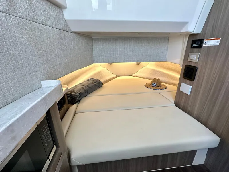 Slide: The Image of Luxurious interior cabin of 2021 Regal 38 SAV boat with cozy seating. - 35
