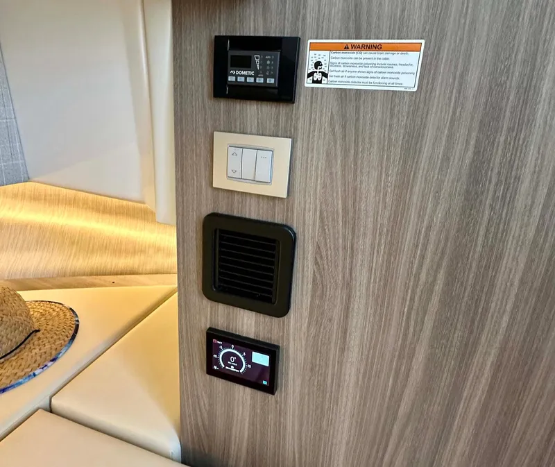 Slide: The Image of Control panel and switches inside 2021 Regal 38 SAV boat cabin. - 37