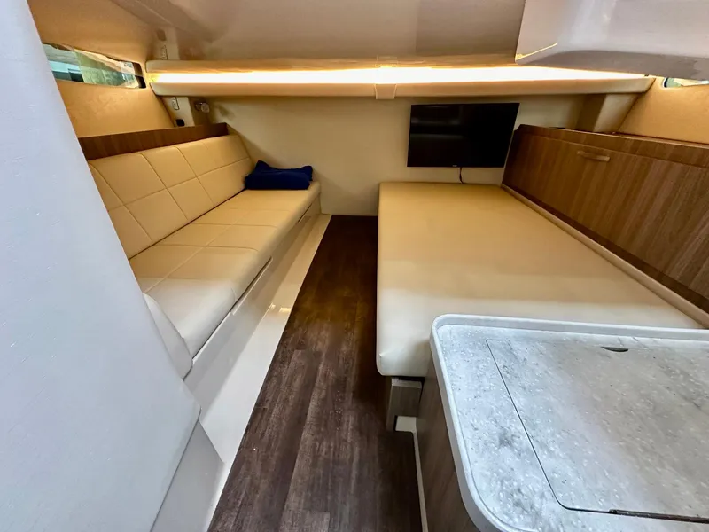 Slide: The Image of Interior of 2021 Regal 38 SAV yacht with modern seating and wood accents. - 40