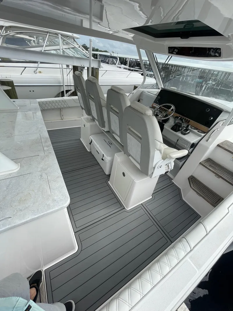 Slide: The Image of 2021 Regal 38 SAV boat interior with modern seating and sleek design. - 46