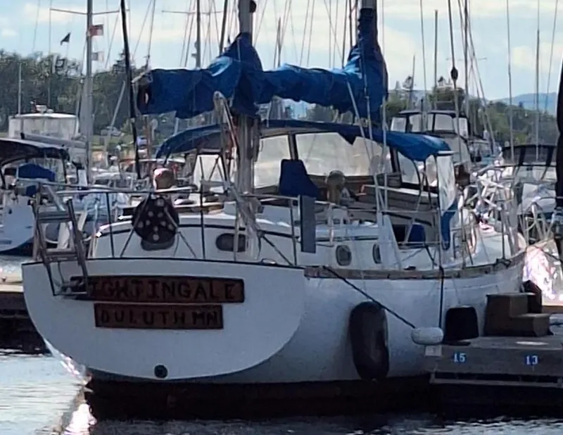 Slide: The Image of 1976 Cheoy Lee 40 Center Cockpit sailboat docked in a marina. - 13