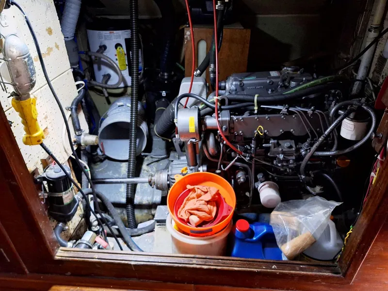 Slide: The Image of Engine room of a 1976 Cheoy Lee 40 Center Cockpit sailboat with maintenance tools. - 36