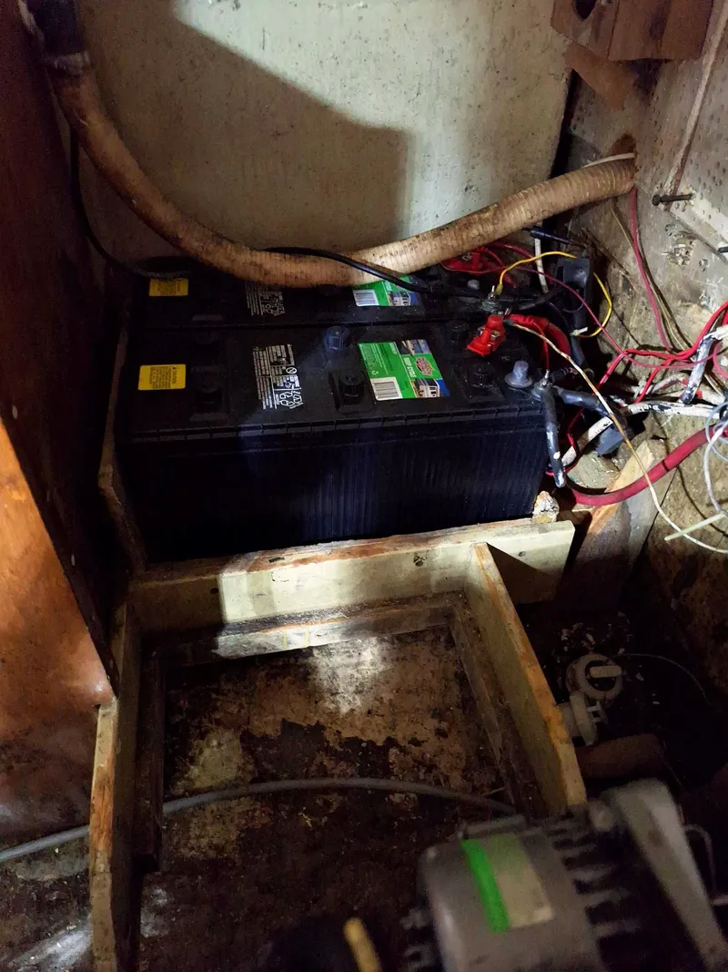 Slide: The Image of Battery compartment of a 1976 Cheoy Lee 40 Center Cockpit sailboat, showing wiring and connections. - 39