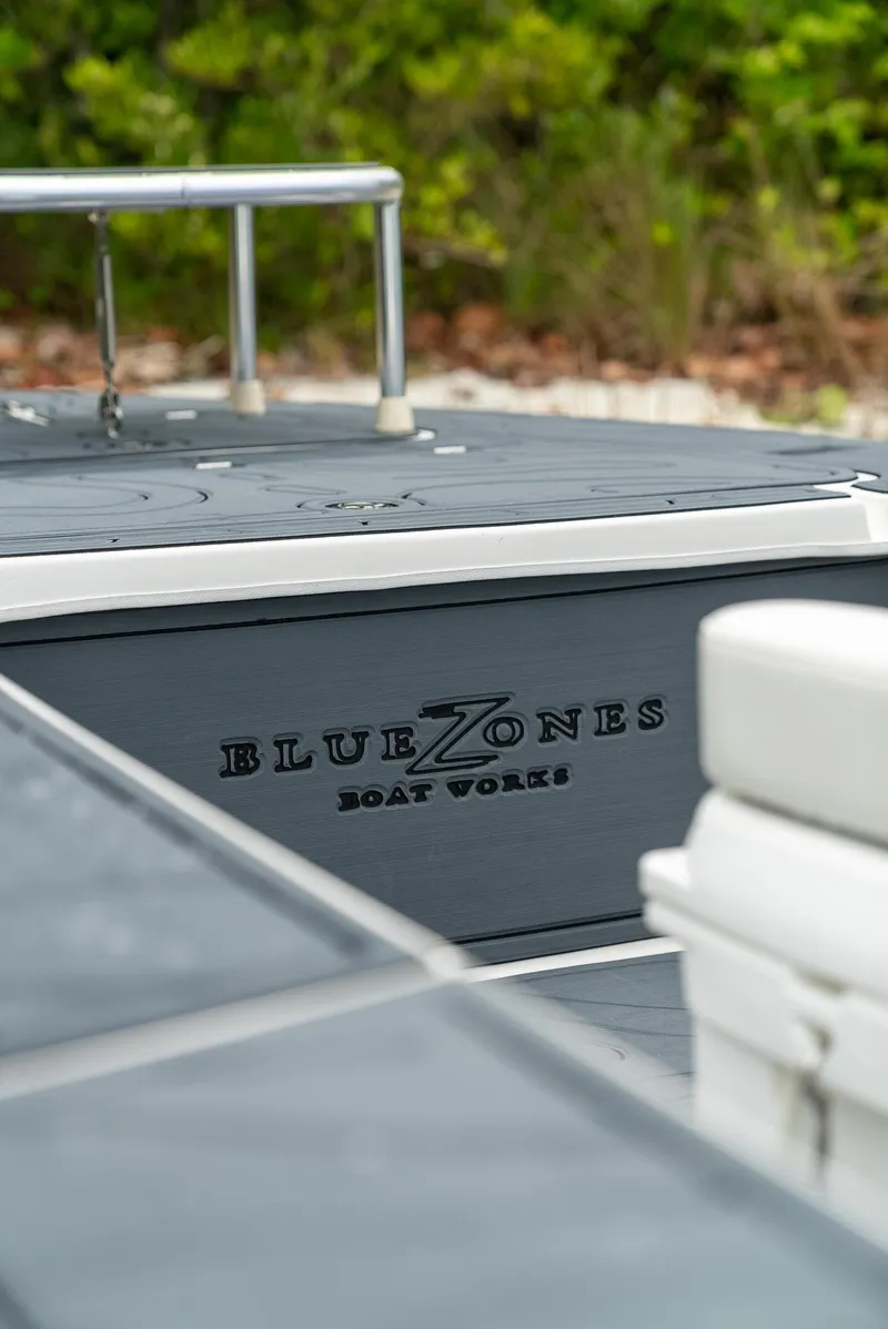 Slide: The Image of 2025 BlueZones Boatworks 16' Flats boat, sleek design, outdoor setting. - 25