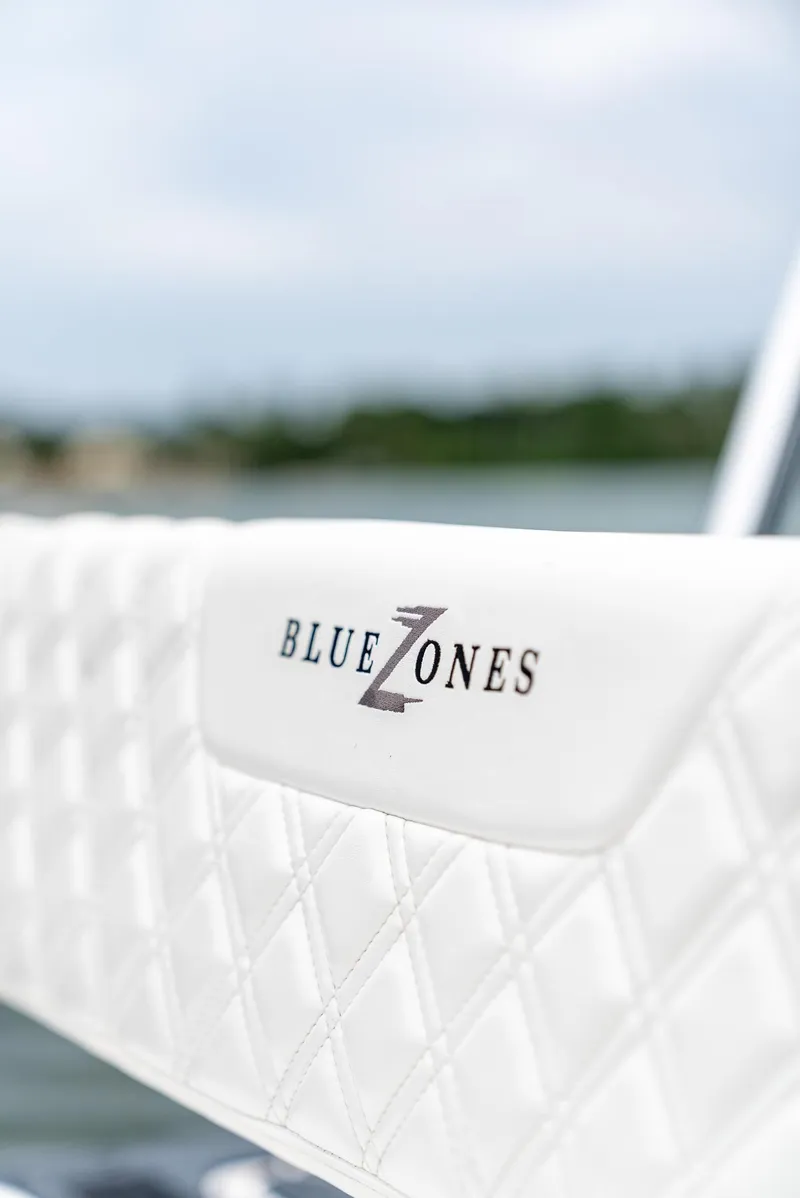 Slide: The Image of Close-up of BlueZones Boatworks 2025 16' Flats boat seat with logo. - 28