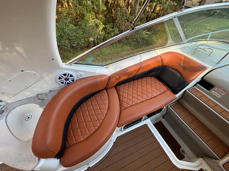 Slide: The Image of Luxurious seating on 2005 Sea Ray 260 Sundancer boat with brown leather upholstery. - 17