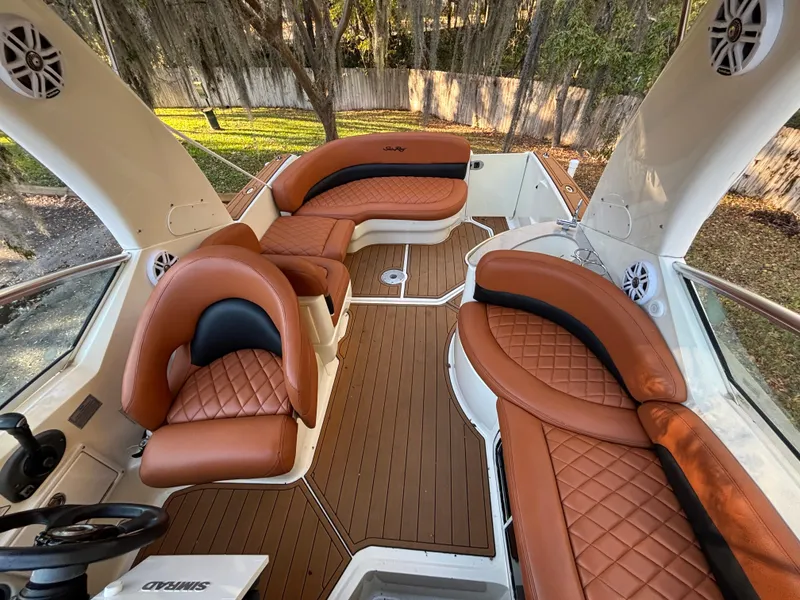 Slide: The Image of Luxurious 2005 Sea Ray 260 Sundancer boat interior with brown leather seating. - 21