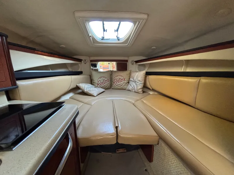 Slide: The Image of Interior of 2005 Sea Ray 260 Sundancer with cozy seating and skylight. - 23
