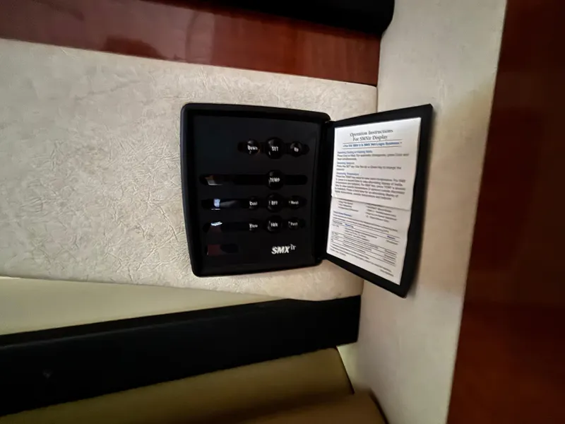 Slide: The Image of Control panel inside 2005 Sea Ray 260 Sundancer boat cabin. - 27