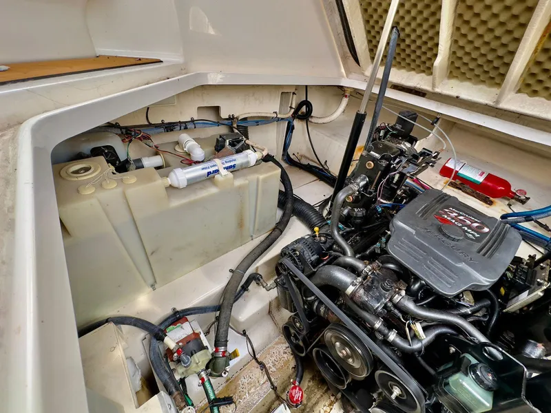 Slide: The Image of Engine compartment of a 2005 Sea Ray 260 Sundancer boat, showing engine and components. - 39
