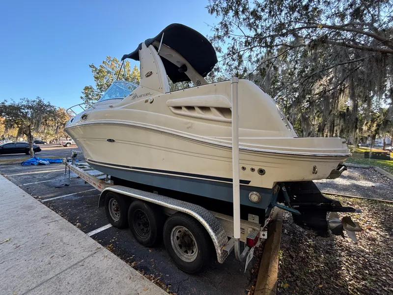 Slide: The Image of 2005 Sea Ray 260 Sundancer boat on trailer in outdoor setting. - 5