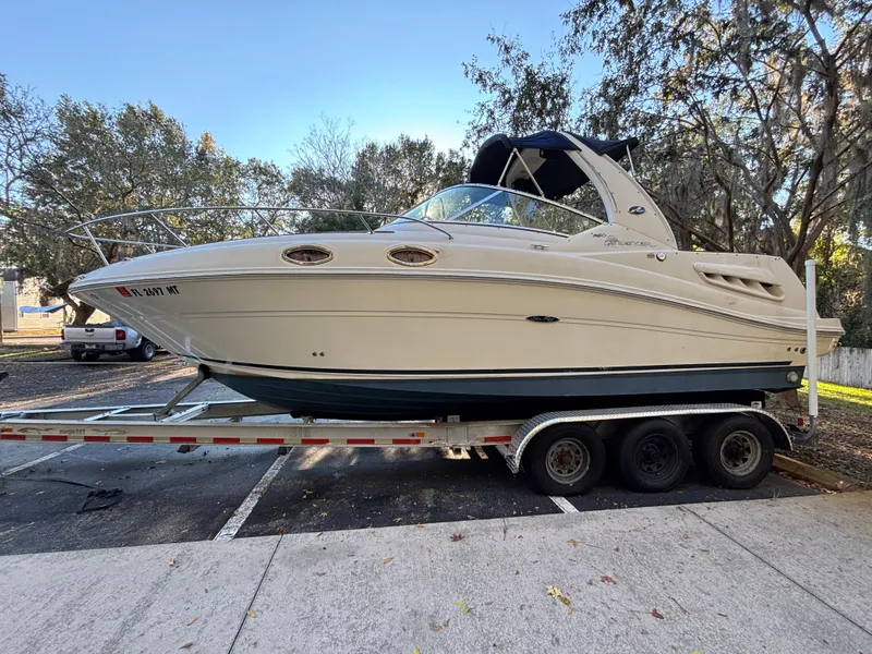 Slide: The Image of 2005 Sea Ray 260 Sundancer boat on trailer in parking lot. - 6