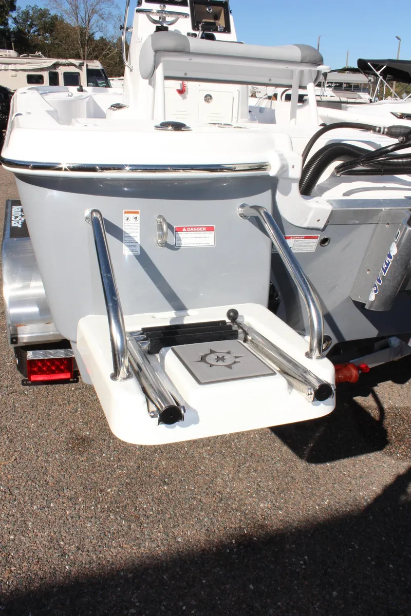 Slide: The Image of 2025 NauticStar 214 Shallow Bay boat with swim platform and ladder. - 11