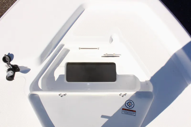 Slide: The Image of 2025 NauticStar 214 Shallow Bay boat deck with storage compartment. - 25