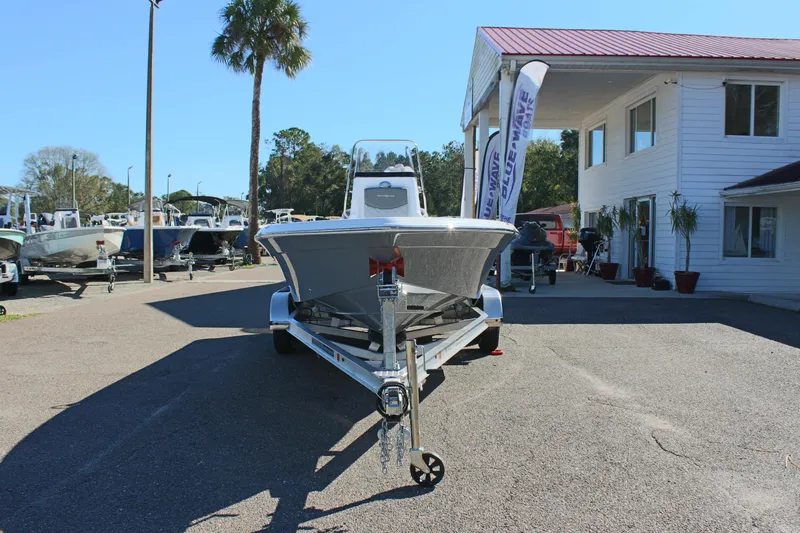 Slide: The Image of 2025 NauticStar 214 Shallow Bay boat on trailer at dealership. - 4