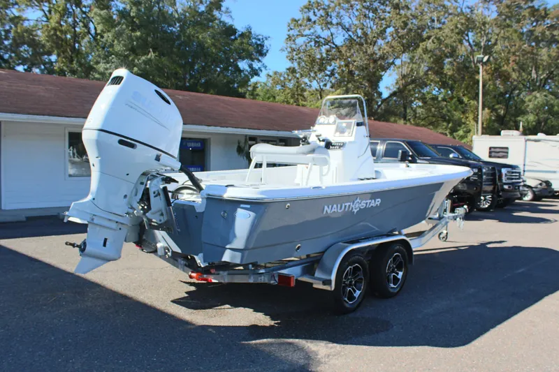 Slide: The Image of 2025 NauticStar 214 Shallow Bay boat on trailer, parked outdoors. - 8