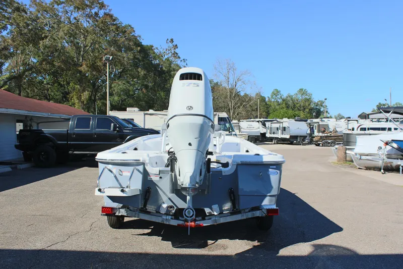 Slide: The Image of 2025 NauticStar 214 Shallow Bay boat, rear view, parked outdoors. - 9