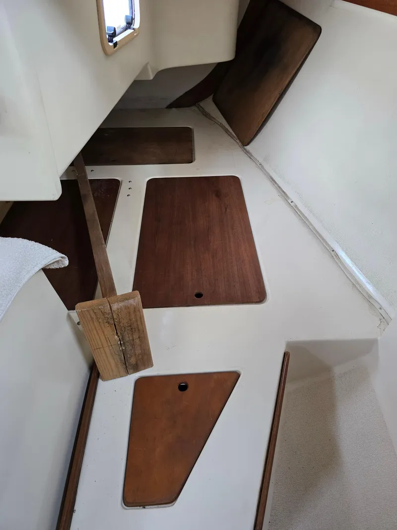 Slide: The Image of 1988 Tartan 31 interior with wooden panels and white walls. - 21