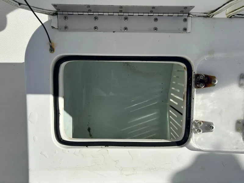 Slide: The Image of Open storage compartment on a 2017 Sea Hunt Gamefish 27 boat. - 14